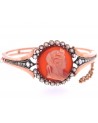 ANTIQUE BRACELET WITH A CORAL CAMEO ON A CORNIOLA BACK SET IN GOLD