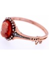 ANTIQUE BRACELET WITH A CORAL CAMEO ON A CORNIOLA BACK SET IN GOLD